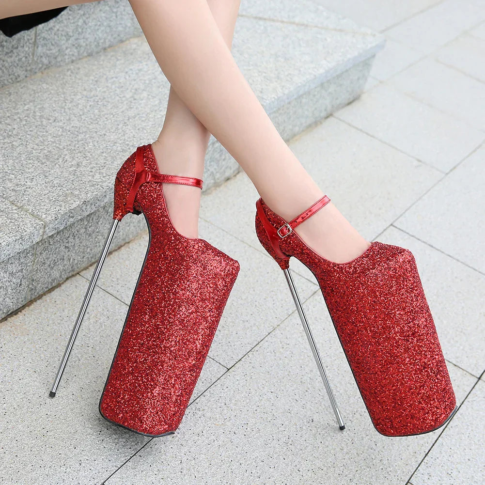 Extremely high platform shoes with glittery red uppers and thin metal stiletto heels.