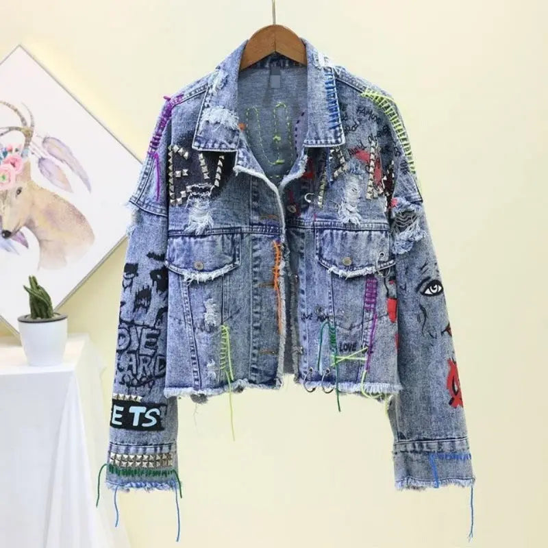 Customized denim jacket with colorful embellishments and distressed details.