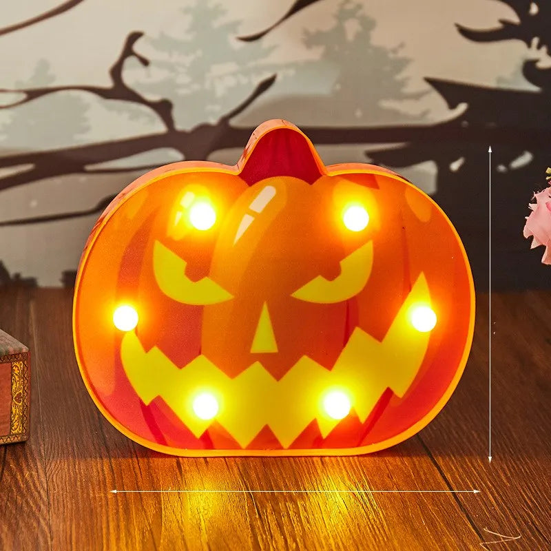 Illuminated jack-o’-lantern decoration with a menacing carved face.