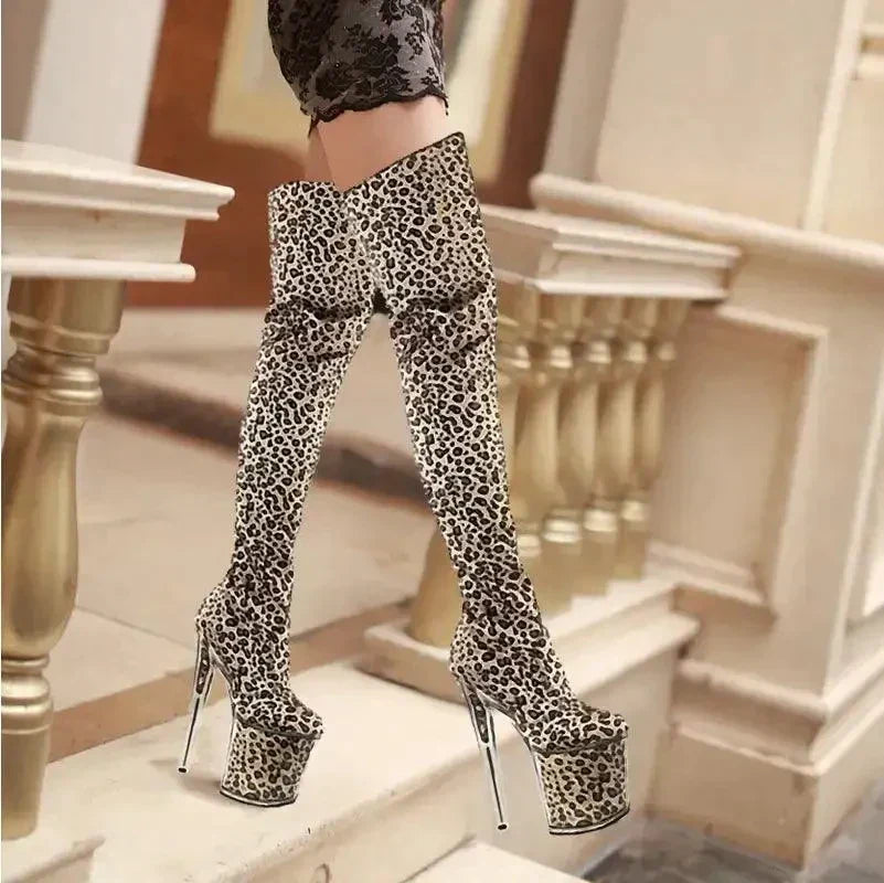 Thigh-high platform boots with a leopard print pattern and extremely high heels.