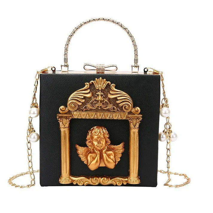 Ornate black handbag with gold baroque-style frame and cherub decoration.