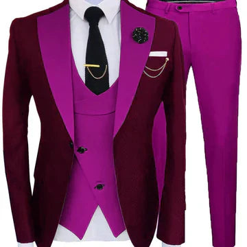 Vibrant three-piece suit in burgundy and magenta with black tie and gold accents.