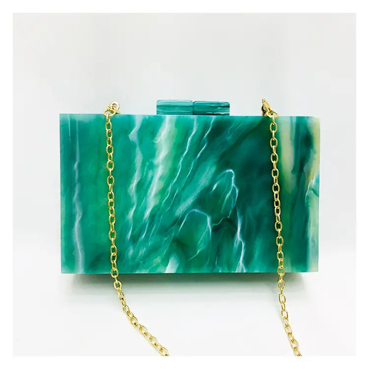 Emerald green marbled acrylic box evening handbag luxury with gold chain strap.