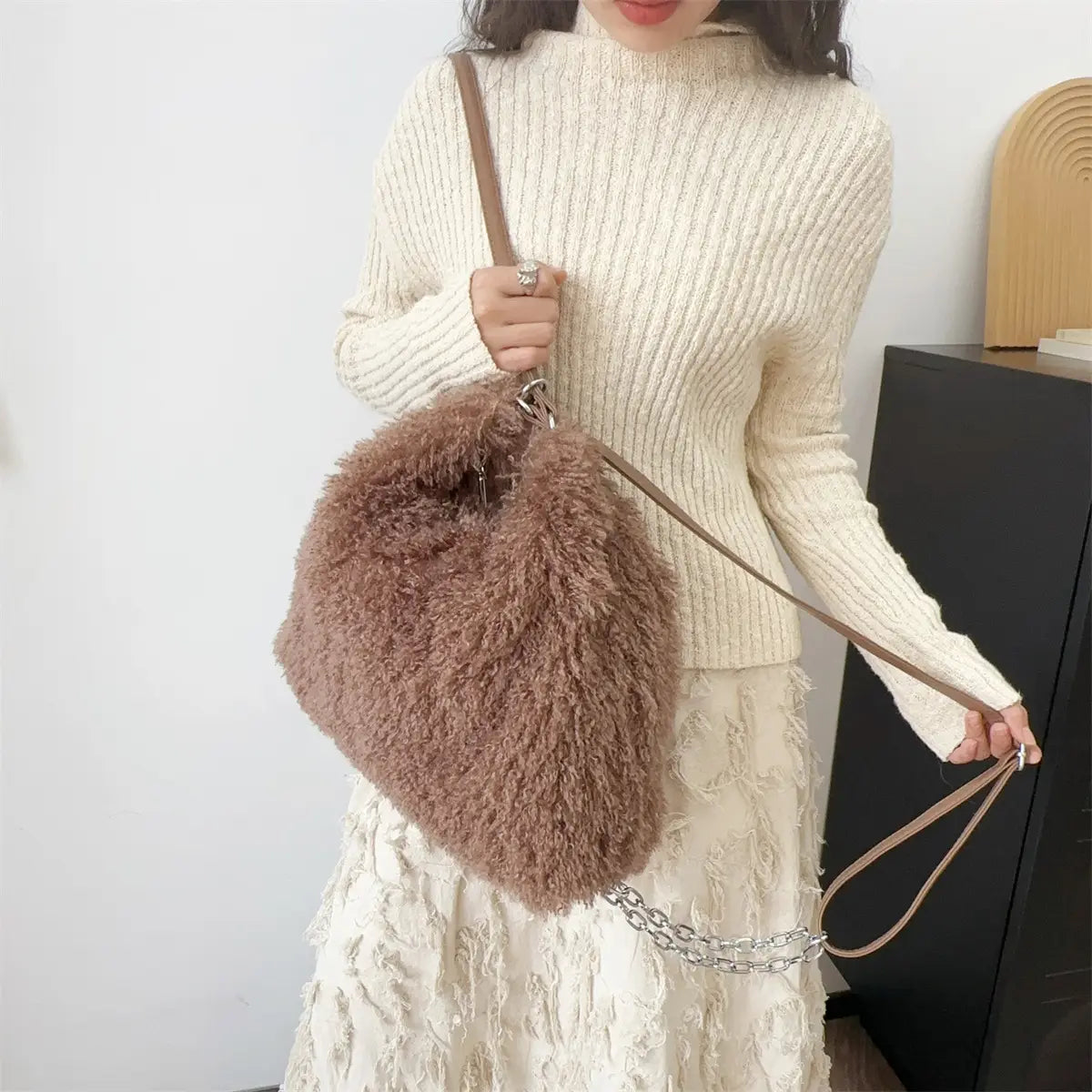 Fluffy brown fur handbag with leather straps, stylish plush large capacity shoulder bag.