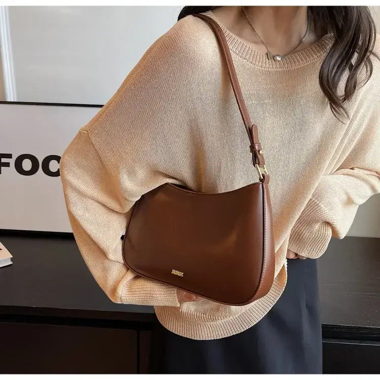 Brown leather shoulder bag crossbody for ladies with adjustable strap, luxury style.