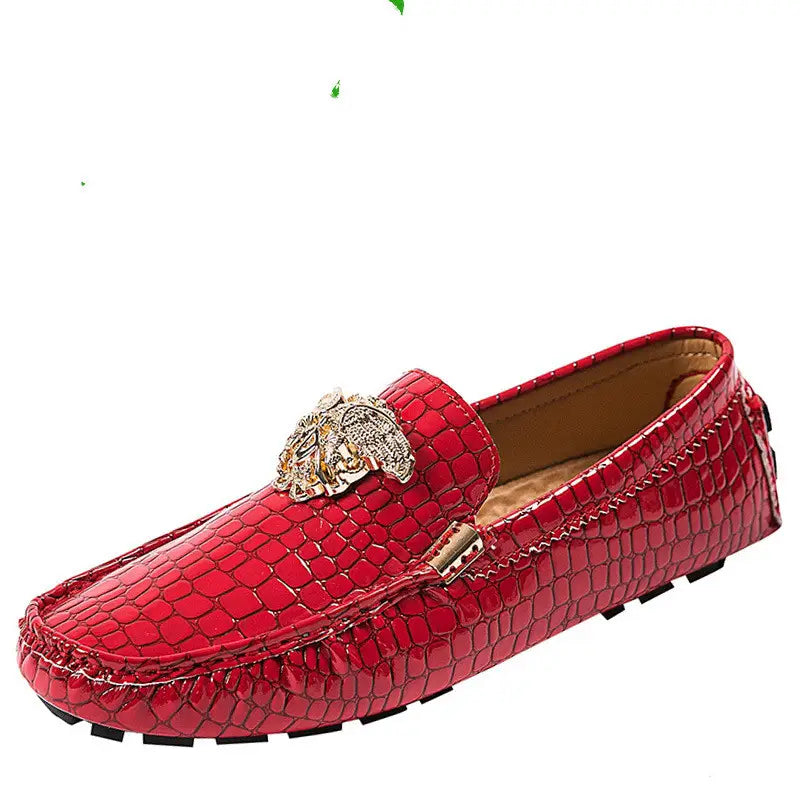 Red crocodile print loafer with gold medallion, perfect for stylish men’s footwear.