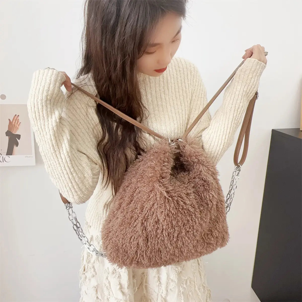 Fluffy brown faux fur handbag with chain and leather straps, perfect plush large capacity style.