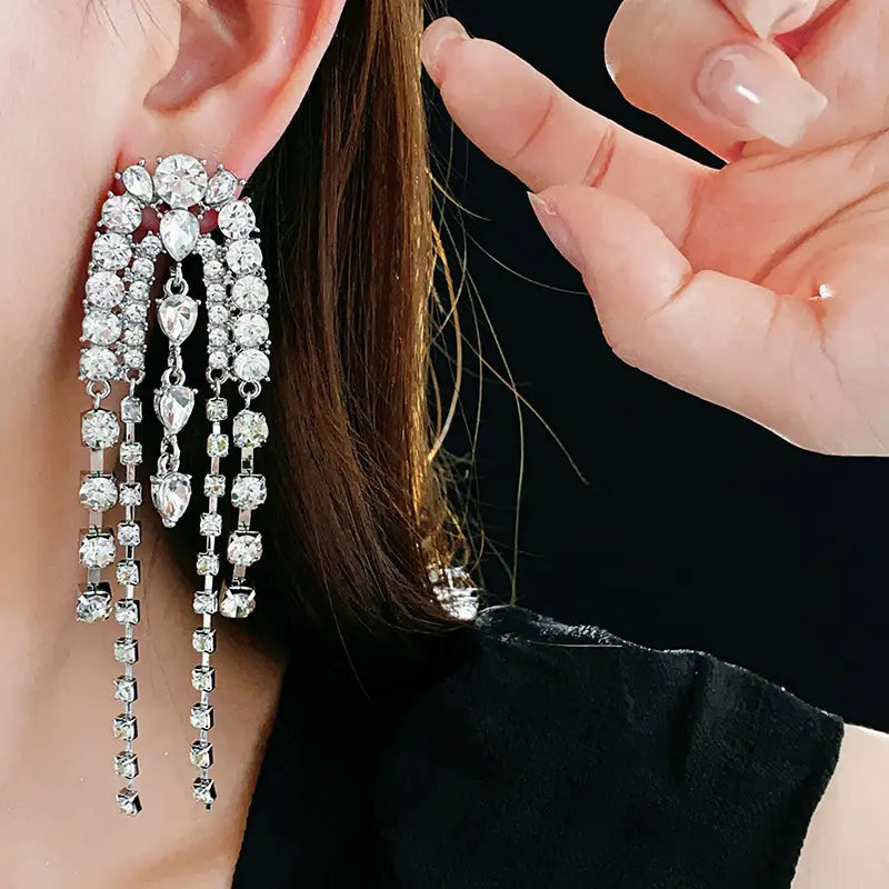 Stunning Water Droplet Shaped Luxury Tassel Earrings with sparkling rhinestone strands.