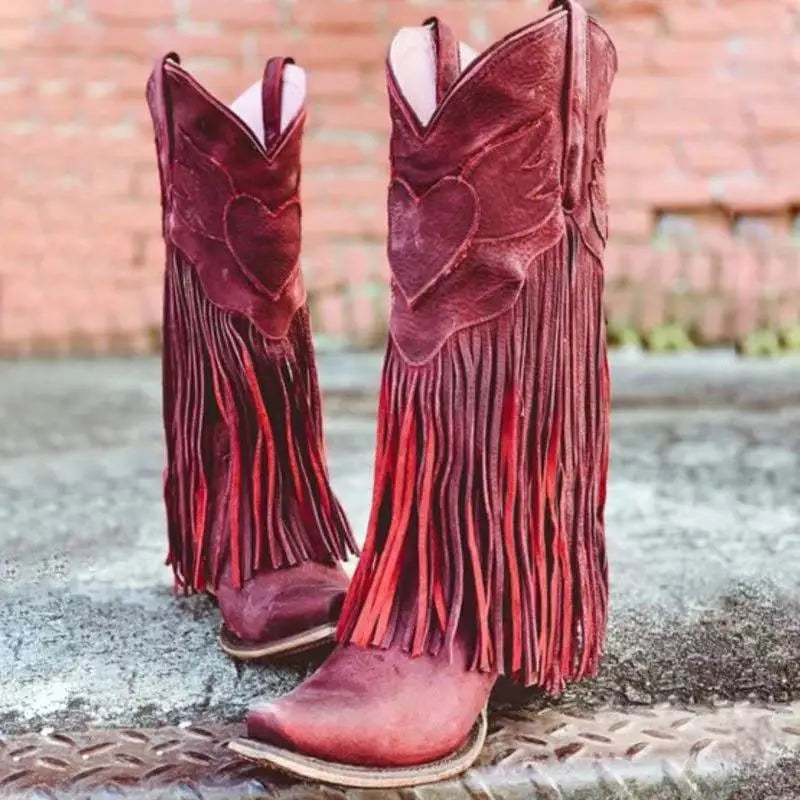 Red leather womens cowboy boots with fun tassel detail and heart designs.