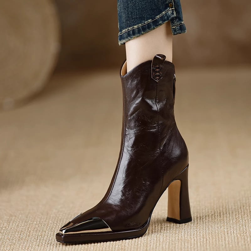 Dark brown leather retro mid-calf boots with metal covered pointed-toe and chunky heel.