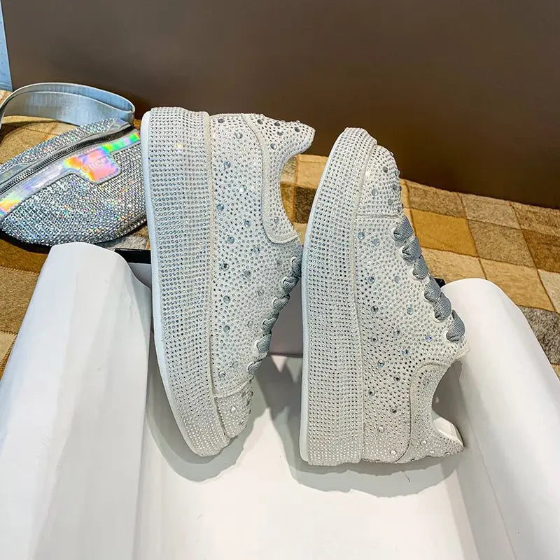 Gray knitted sneakers with lace and rhinestone bling for stylish leisure shoes.