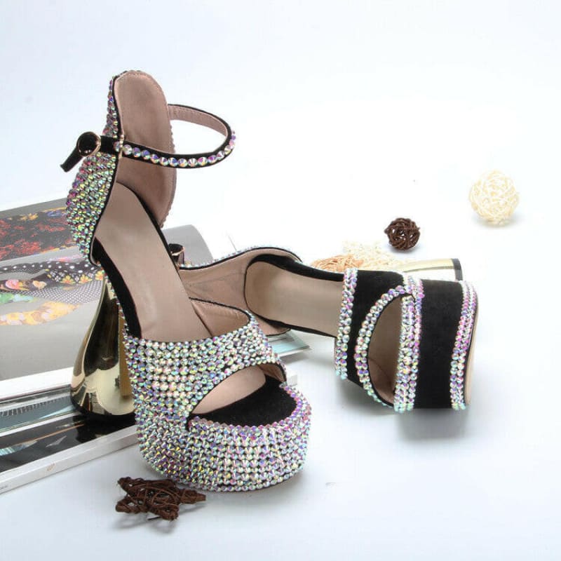 Sparkly high-heeled platform sandal with rhinestone embellishments and an ankle strap.