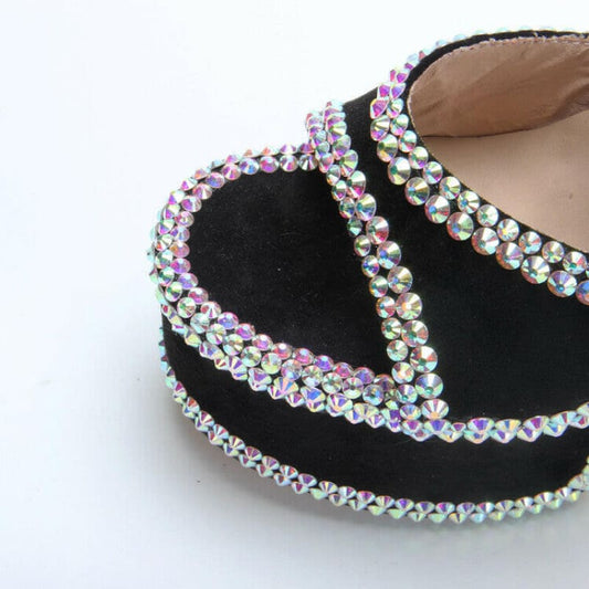 Black ballet flat adorned with iridescent rhinestones along its edges.