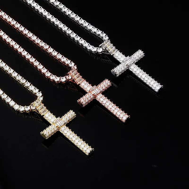 Three stylish diamond-encrusted cross pendants in gold, rose gold, and silver chains.