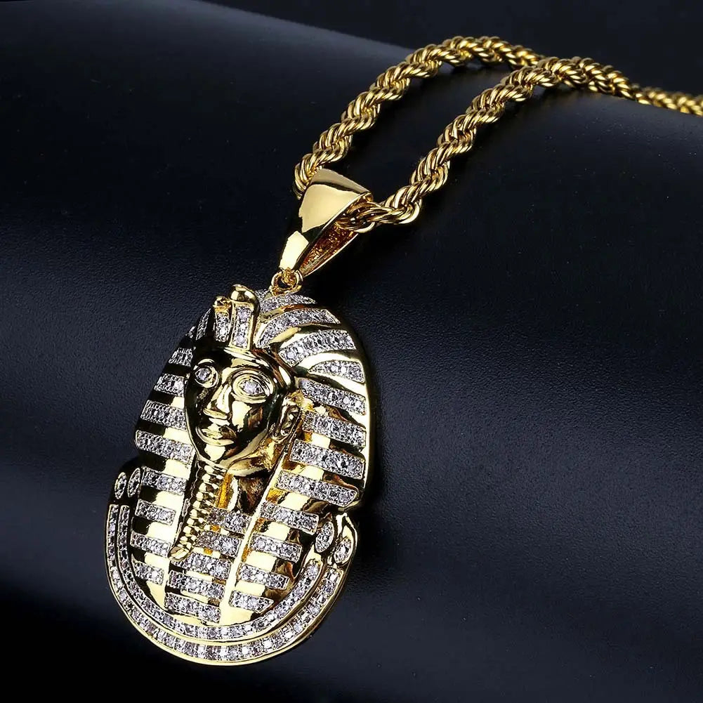 Gold and diamond-encrusted Egyptian pharaoh pendant on a steampunk style copper necklace.