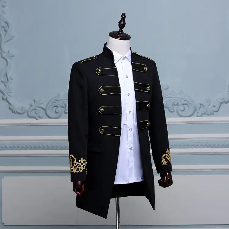 Military-style black double-breasted embroidered long slim fit jacket on mannequin.