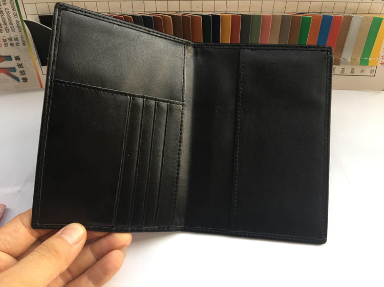 Stylish Black Leather Travel Wallet with RFID Protection, perfect for travel essentials.