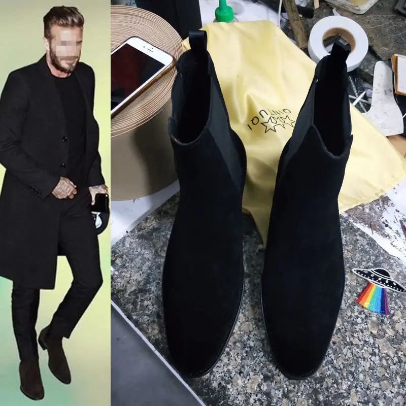 Black suede pointed toe high-top Chelsea boots for men with elastic side panels.