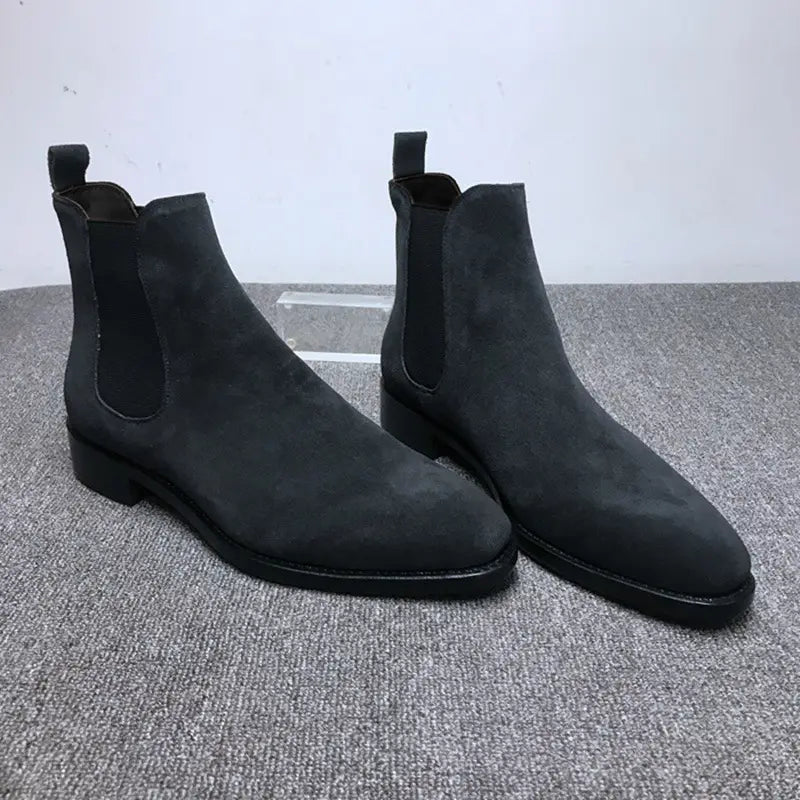 Men’s suede pointed toe high-top Chelsea boots with elastic side panels in black.