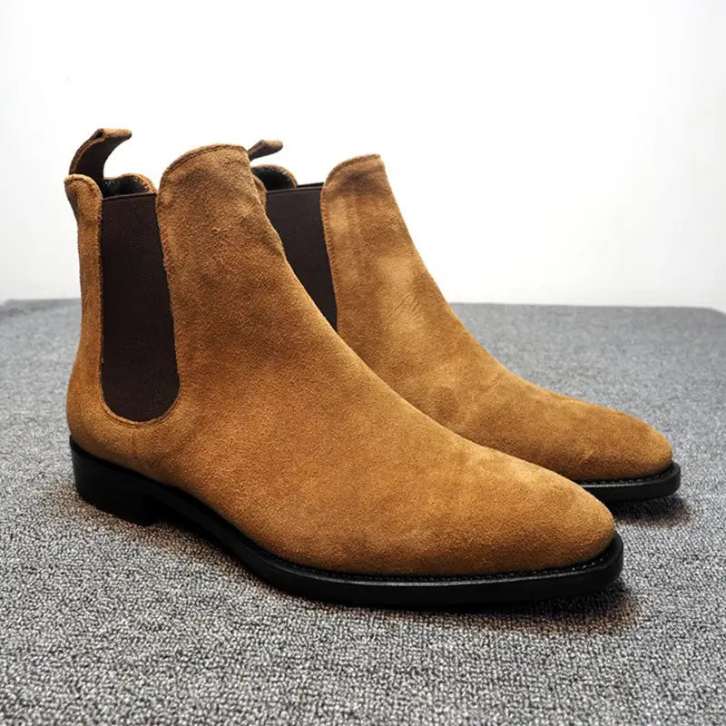 Tan suede pointed toe high-top Chelsea boots for men with elastic side panels.