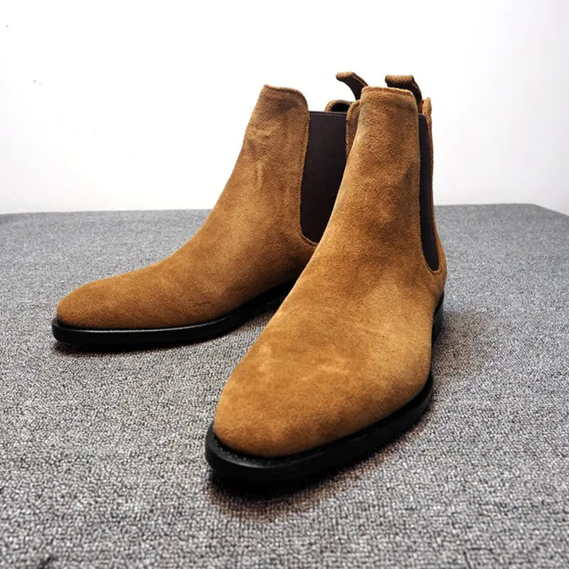 Tan suede pointed toe high-top Chelsea boots for men with elastic side panels.