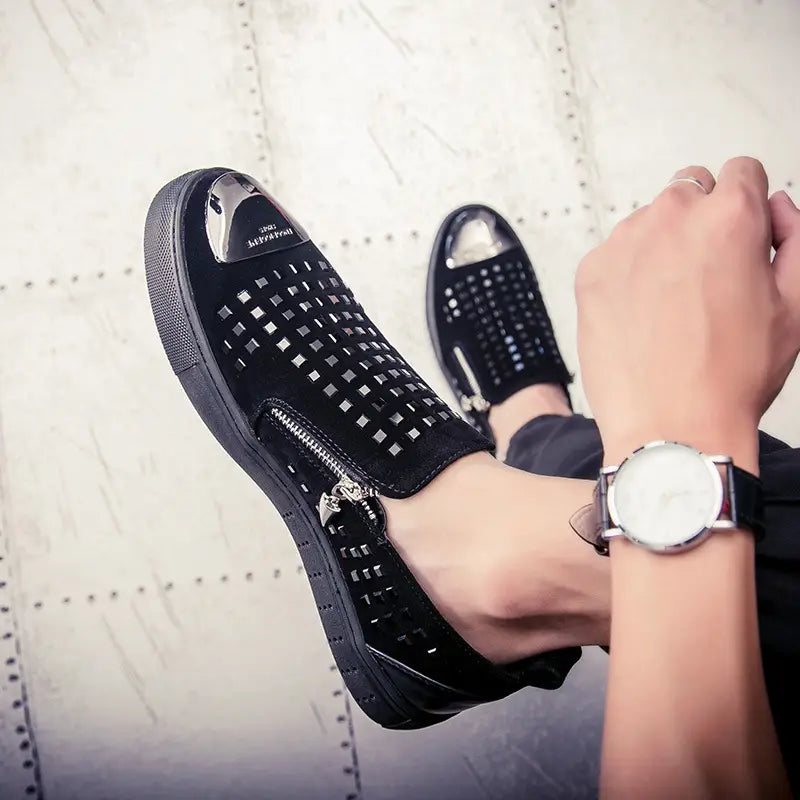 Black studded slip-on sneakers, perfect for a bold look in British style rhinestone fashion.