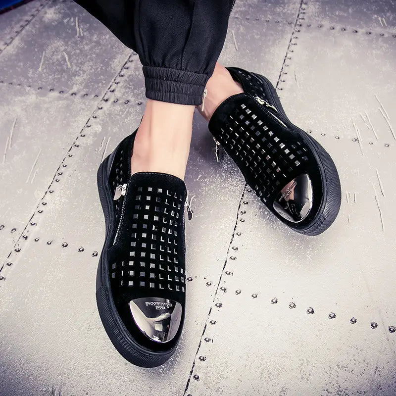 Black patent leather slip-on studded fashion shoes for a bold British style look.