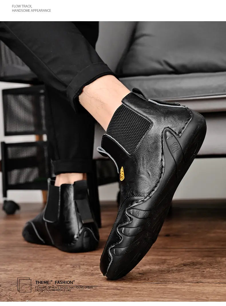 Black leather ankle boot with elastic sides for warm men’s casual shoes and stylish comfort.