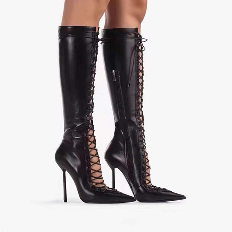 Black leather stiletto heel dominatrix sandal boots with lace-up design and pointed toes.