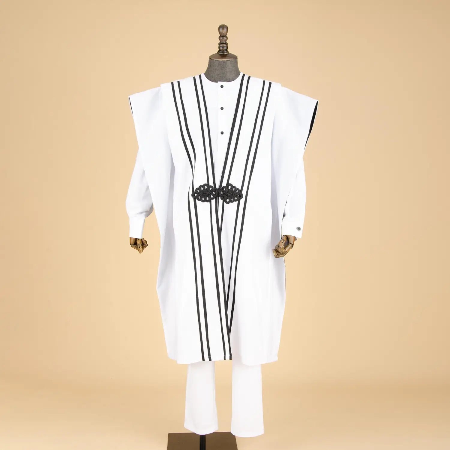 White men’s formal tunic with black stripes, part of an embroidered four-piece suit.