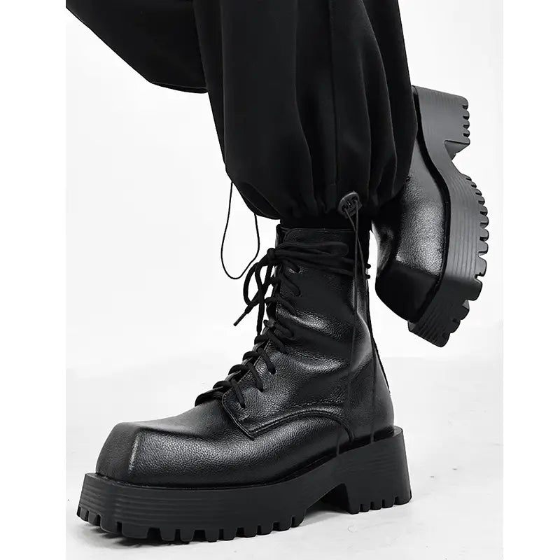 Black leather combat boot with chunky platform, perfect for stylish Martin boots men’s.