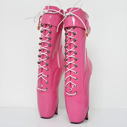 Pair of bright pink ballet-style boots with high heels and lace-up fronts.