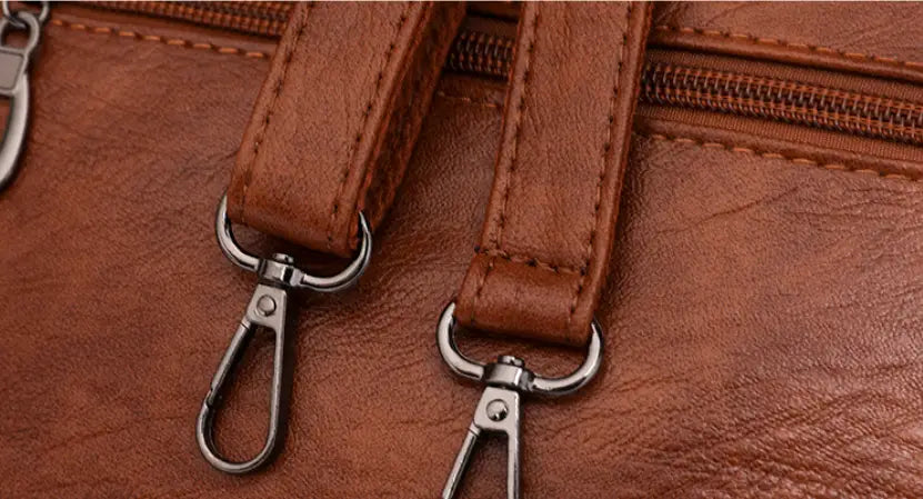 Brown leather straps with metal clasps on Women’s Fashion Large Capacity Handbag.