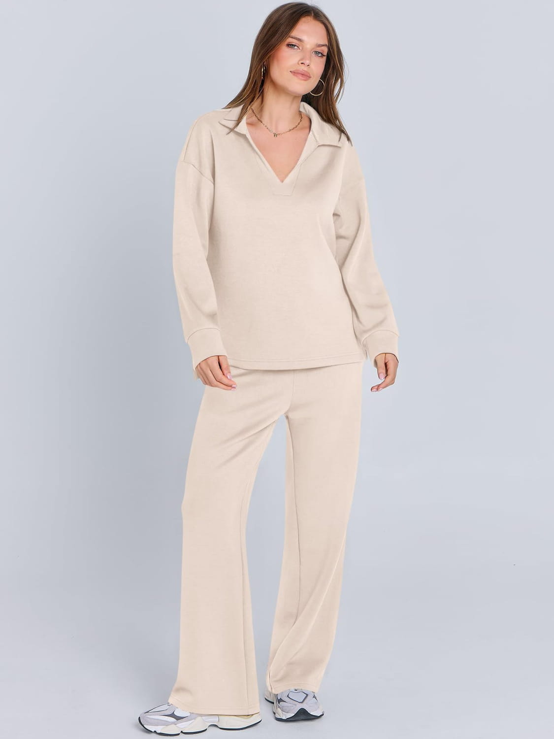 Cream-colored ladies two piece casual outfit set with pockets and wide-leg pants.