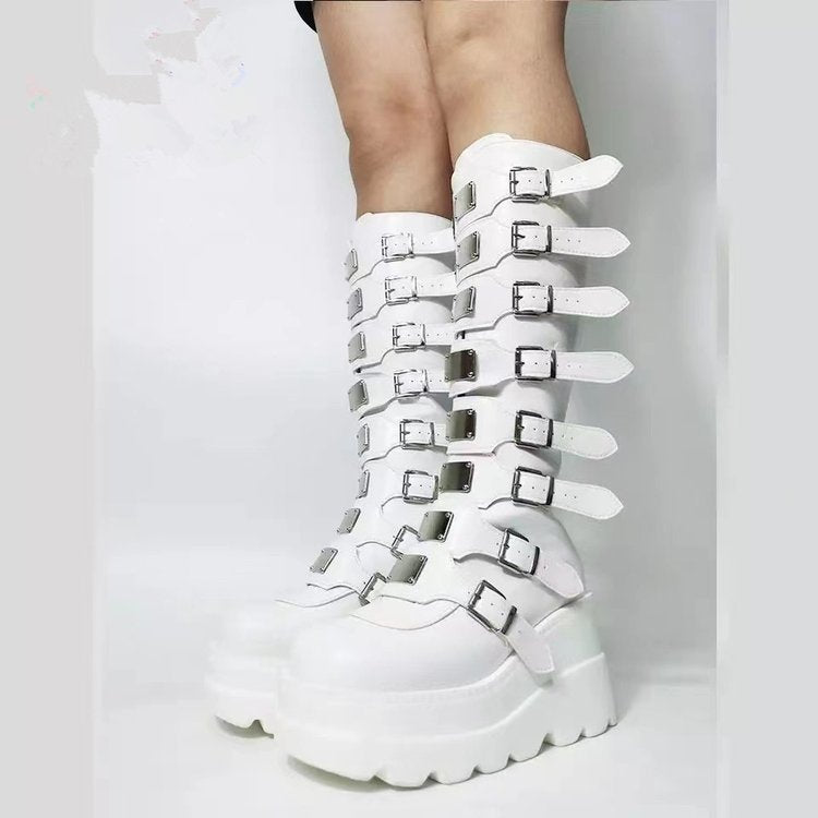 White platform high leg boots with multi metal buckles for punk emo style.