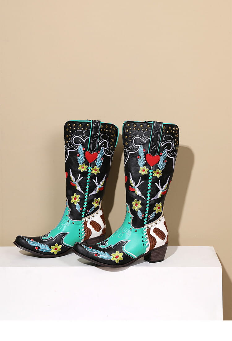 Turquoise and black women’s western boots with exquisite embroidery and floral details.