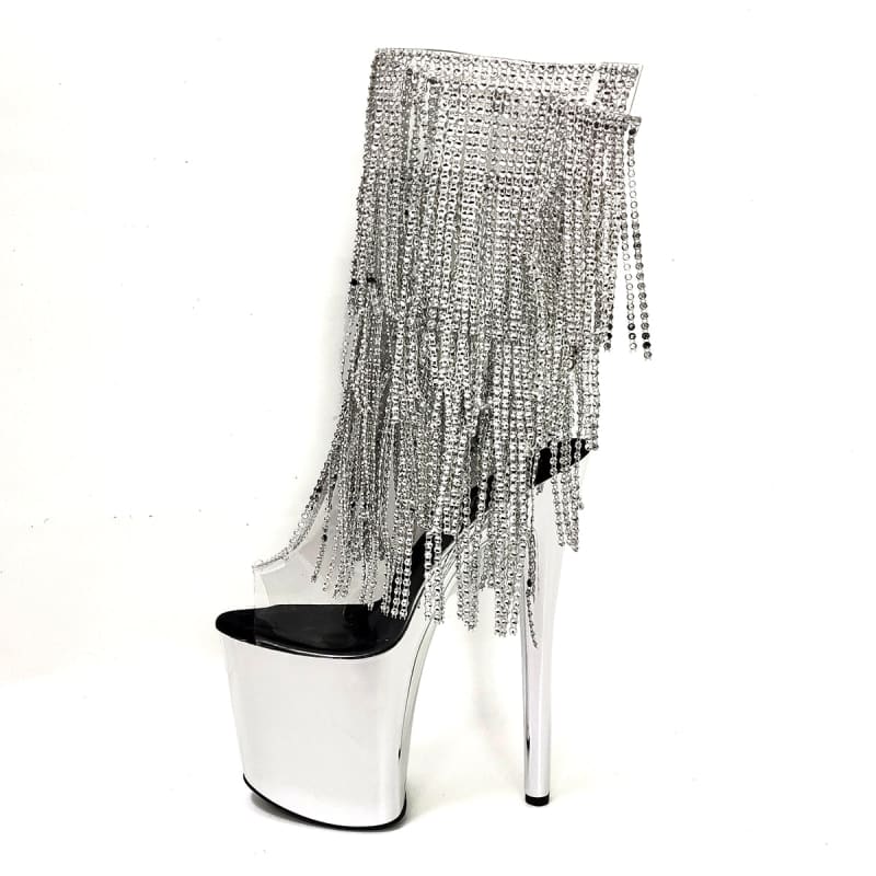 Extremely high platform boot with metallic silver fringe cascading down the shaft.