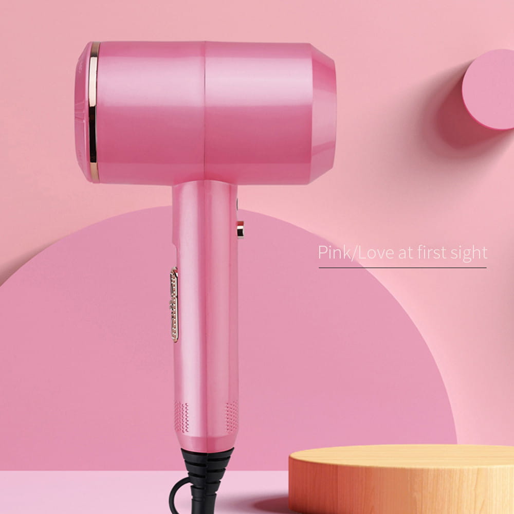 Pink electric hair dryer with cylindrical barrel design, perfect salon high power household hair dryer.