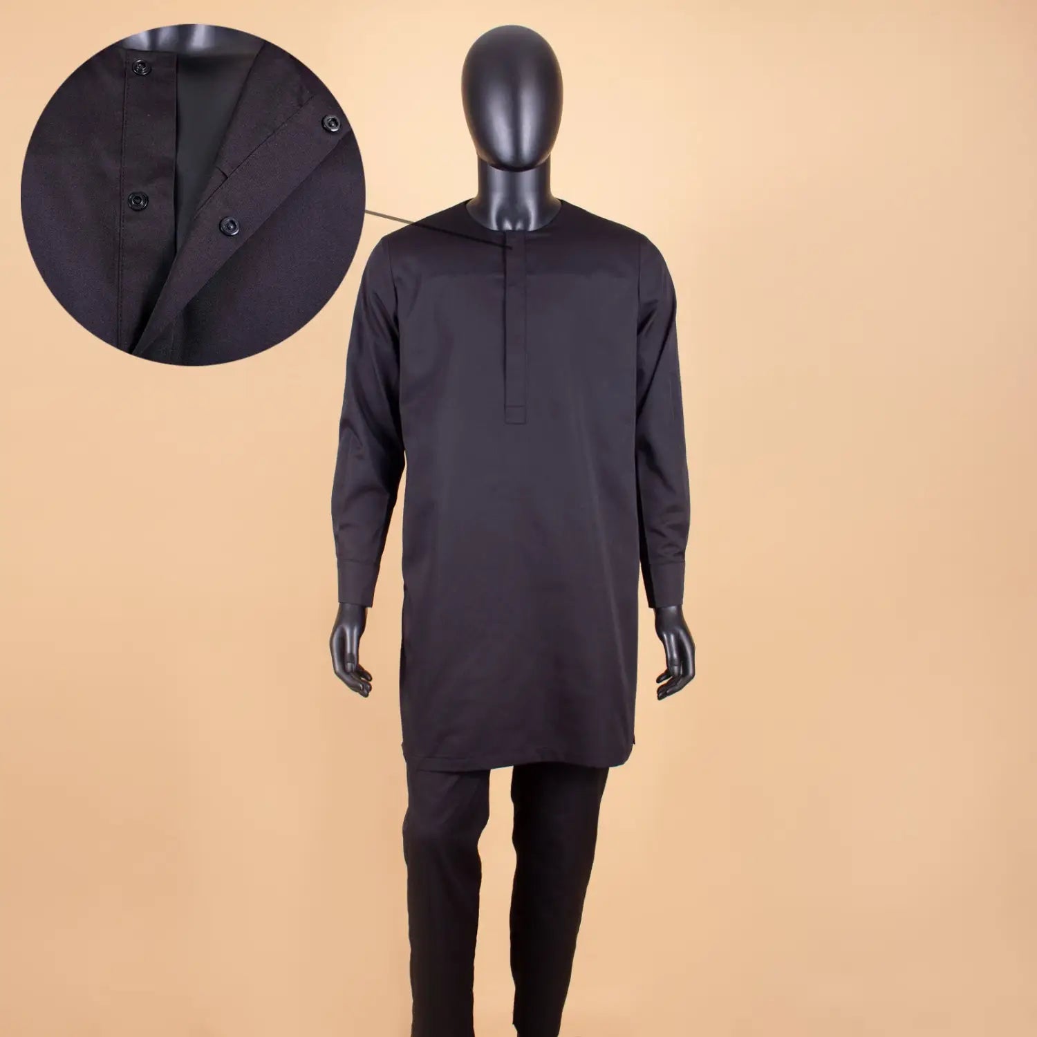 Black long-sleeved thobe on a mannequin from Traditional African Men’s Tuxedo Set.