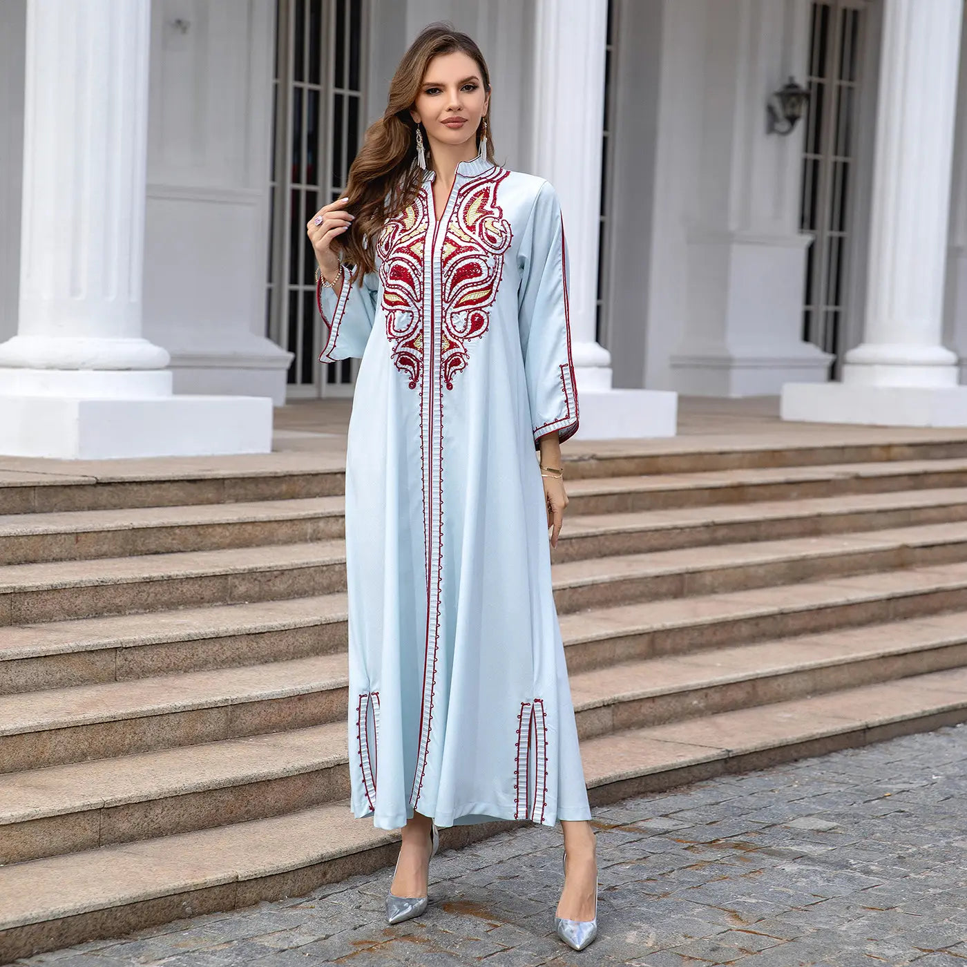 Light blue Kaftan dress with red embroidery details for a stylish Muslim Middle East look.