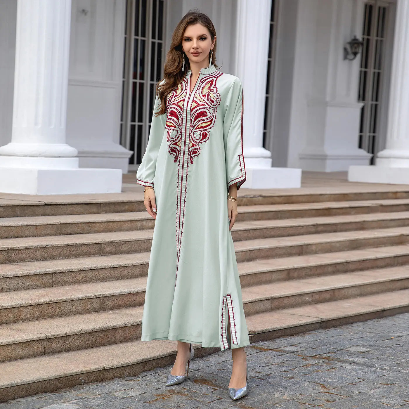 Mint green kaftan dress with red embroidery, perfect for Muslim Middle East style.