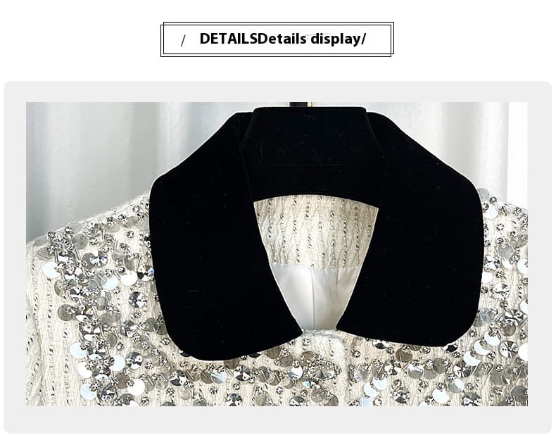 Black U-shaped neck pillow next to Women’s White Exquisite Rhinestone Chanel Style Coat