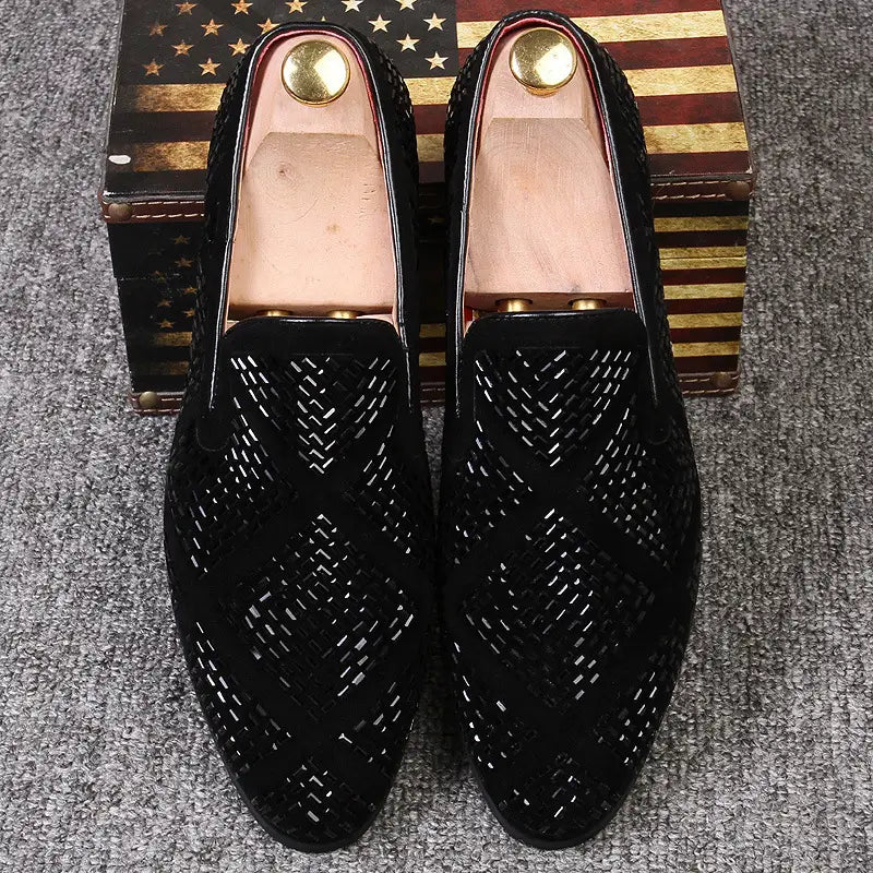 Stylish black suede loafers with perforated design and gold accents, perfect for fashion lovers.