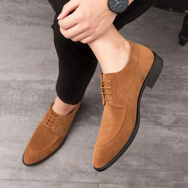 Tan suede oxford dress shoes with pointed toe design for casual brogue carved style.