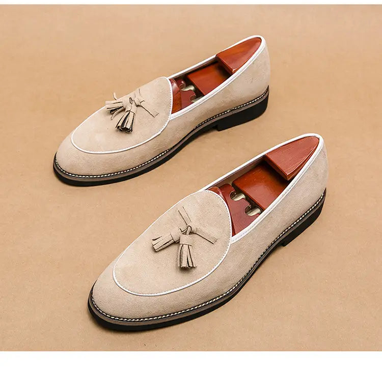 Beige suede tassel loafers with contrast stitching, perfect for the latest mens fashion trend.