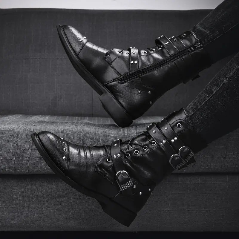 Black leather combat boots with buckles and studs for ceremonial motorcycle rides.