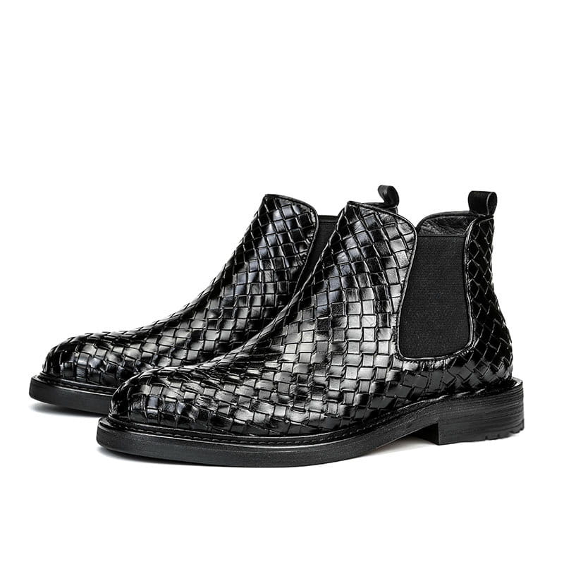 Black woven leather Chelsea boots with elastic side panels for men’s woven pattern style.