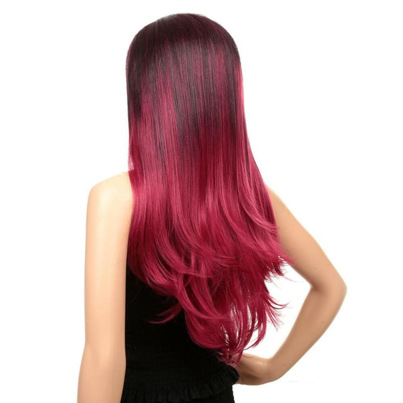 Long, straight hair with a vibrant ombre effect transitioning from dark roots to bright pink ends.