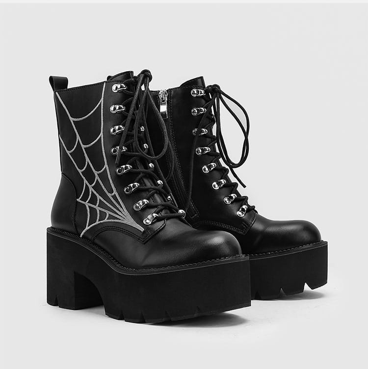 Black platform combat boots with white spider web design perfect for women’s cobweb Halloween.