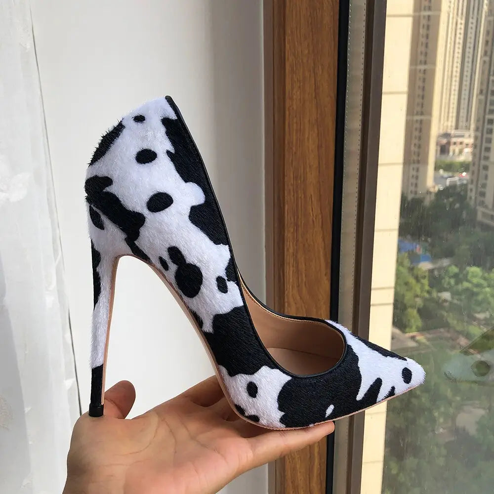 High-heeled pump shoe featuring a stylish cow print hairy flock pointed toe design.